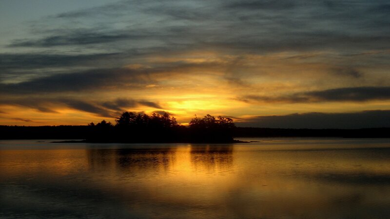 sunset over a calm lake
