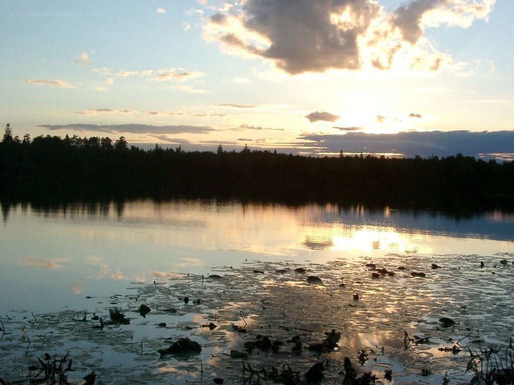 sunset over a calm lake