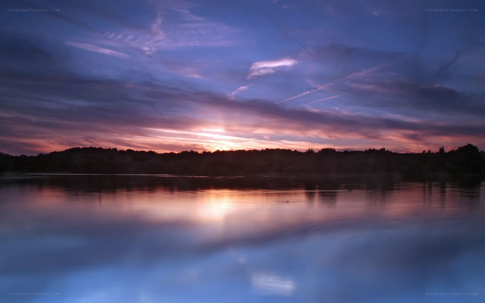 sunset over a calm lake
