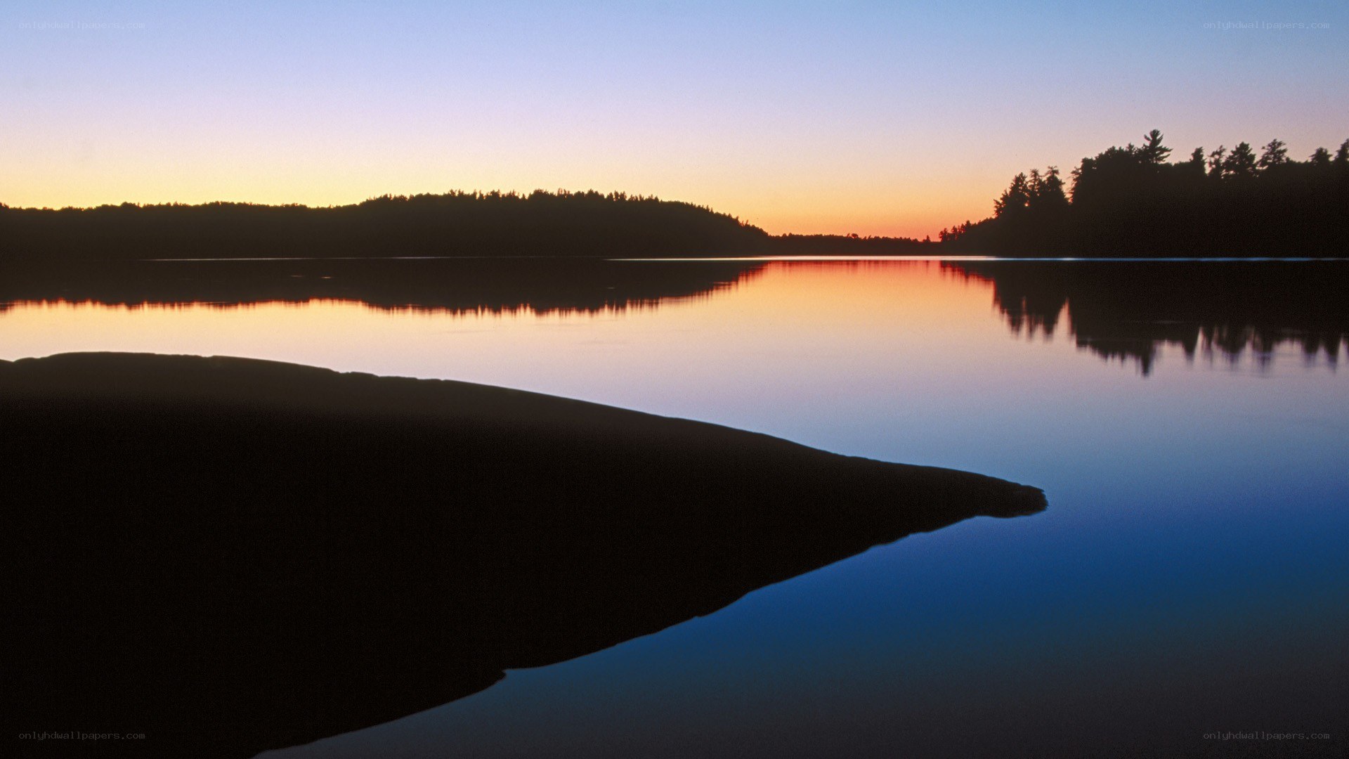 sunset over a calm lake