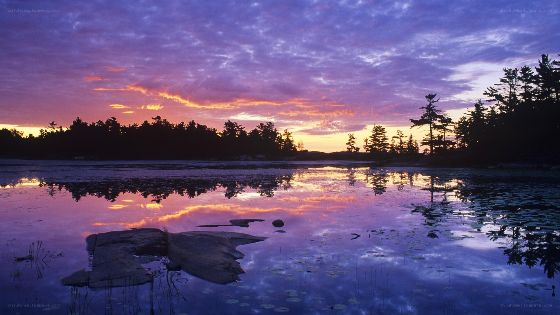 sunset over a calm lake