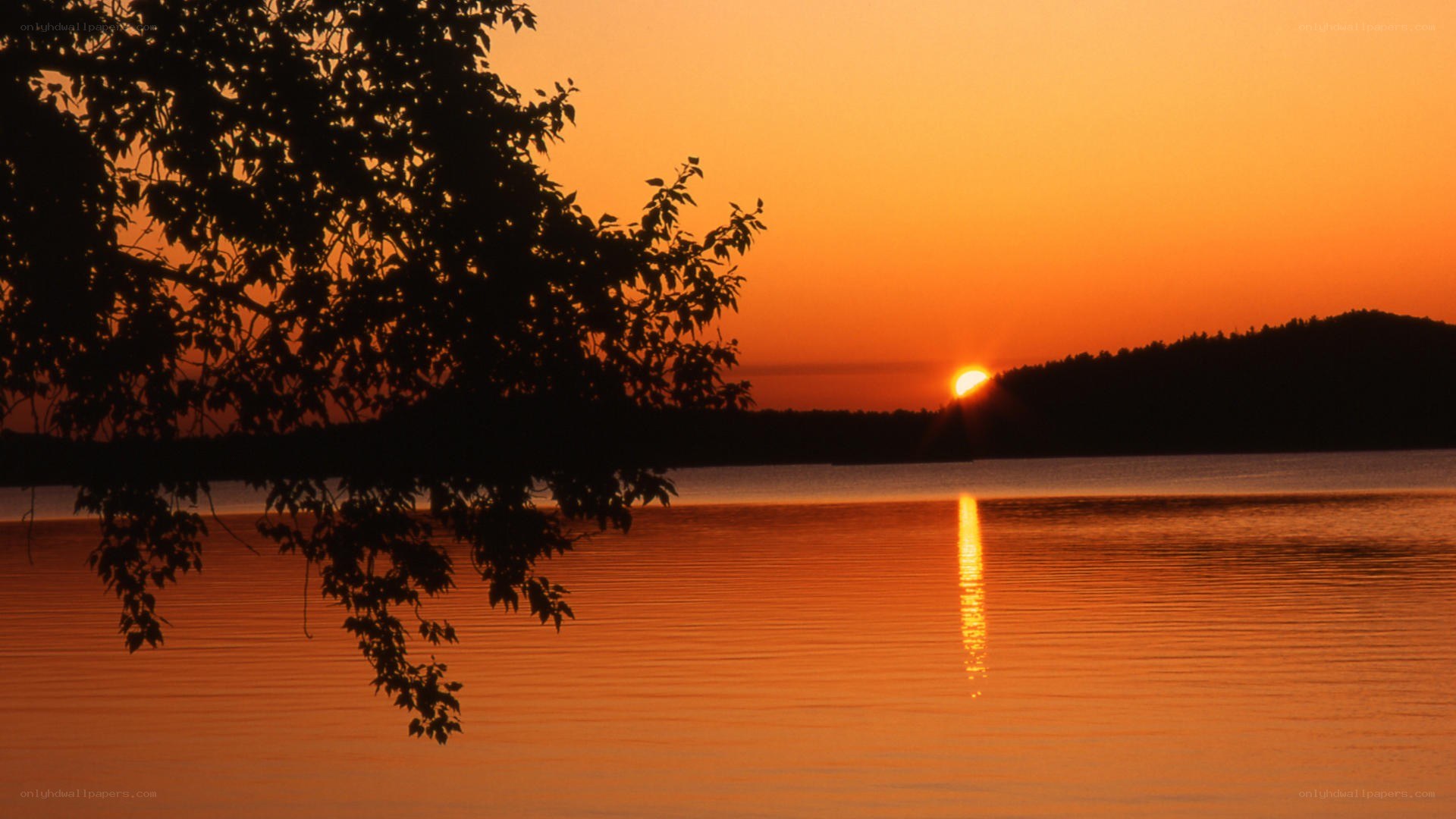 sunset over a calm lake