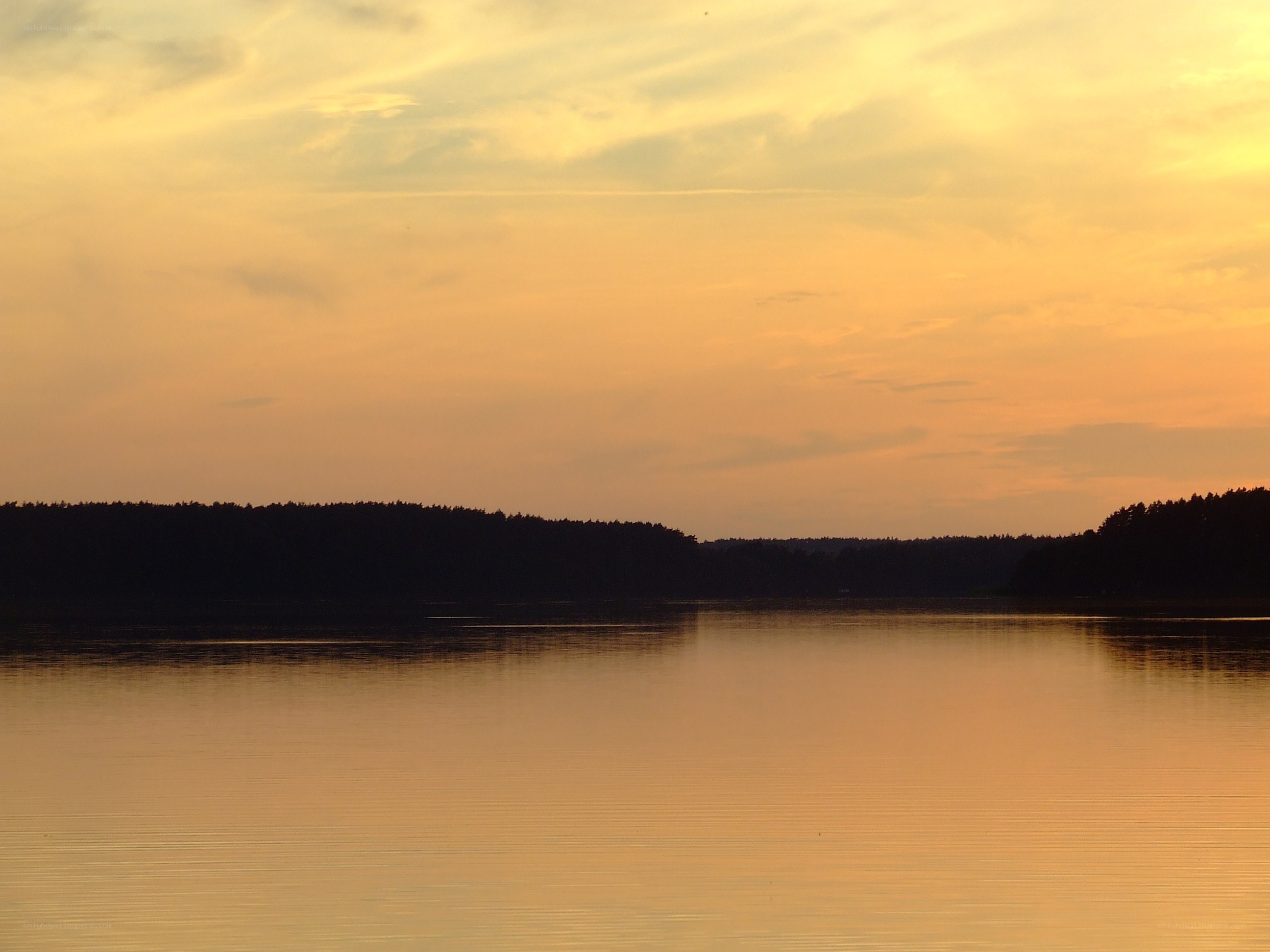sunset over a calm lake