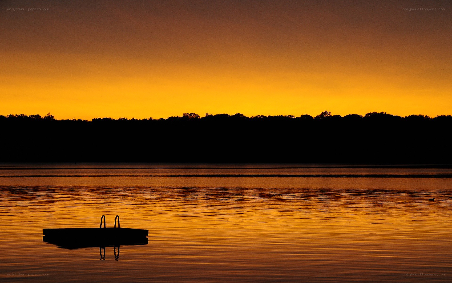 sunset over a calm lake