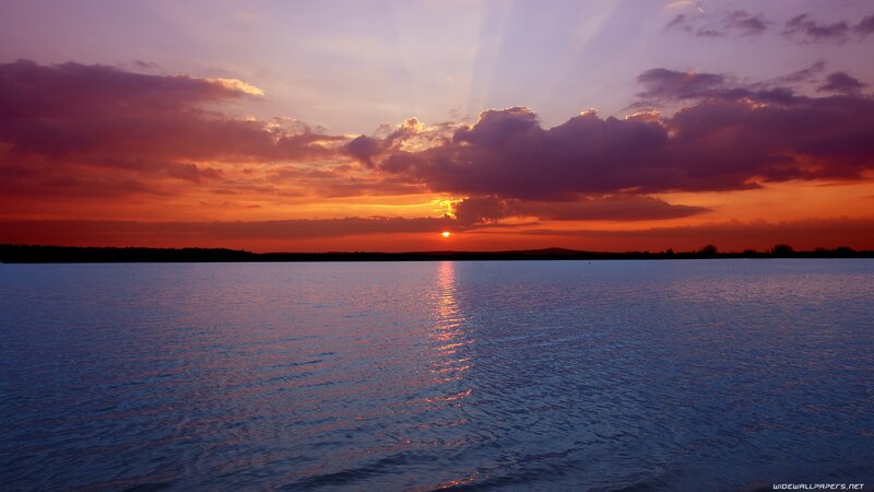 sunset over a calm lake