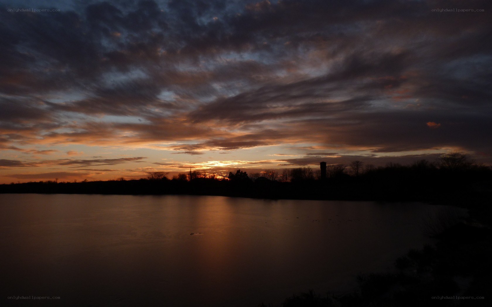 sunset over a calm lake