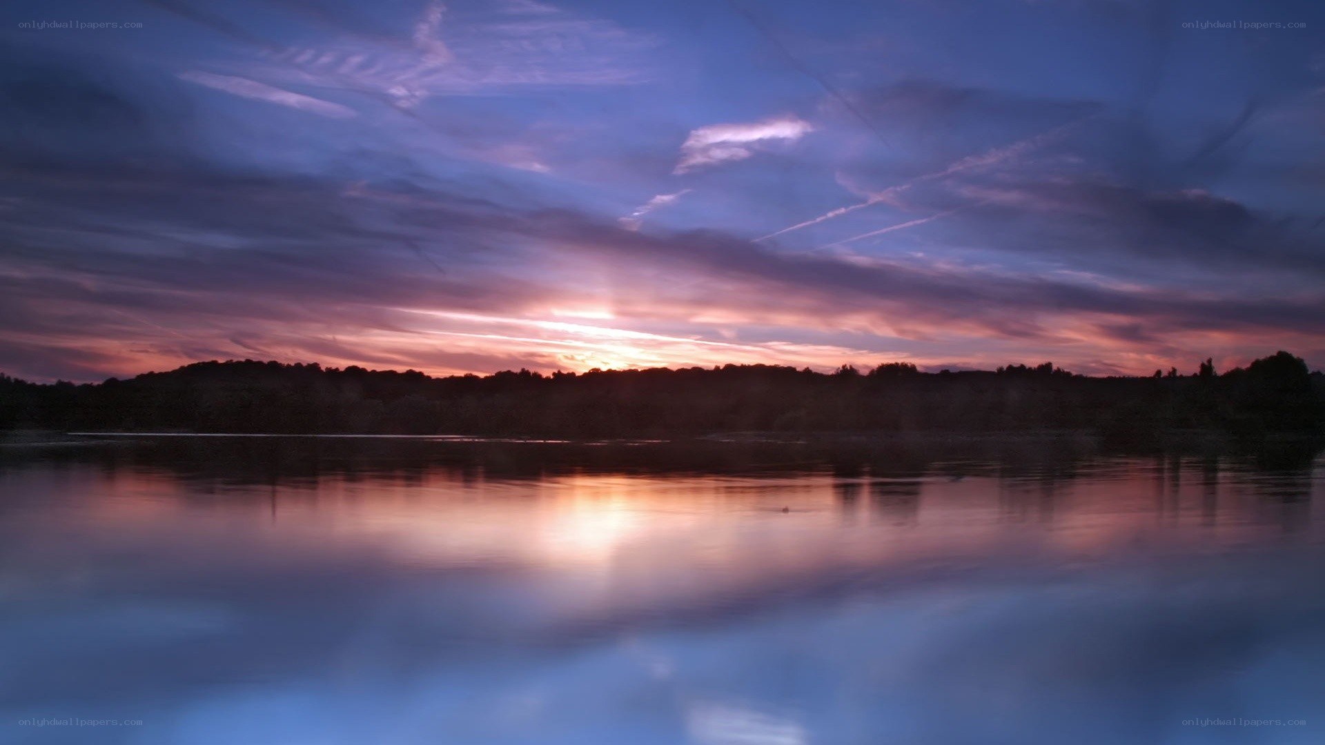 sunset over a calm lake