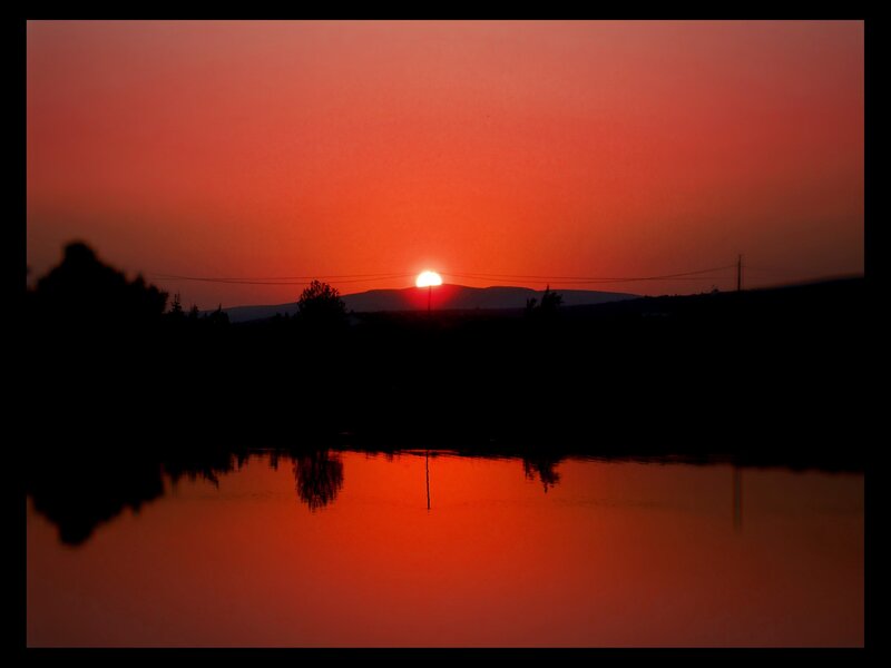 Sunset over a calm lake