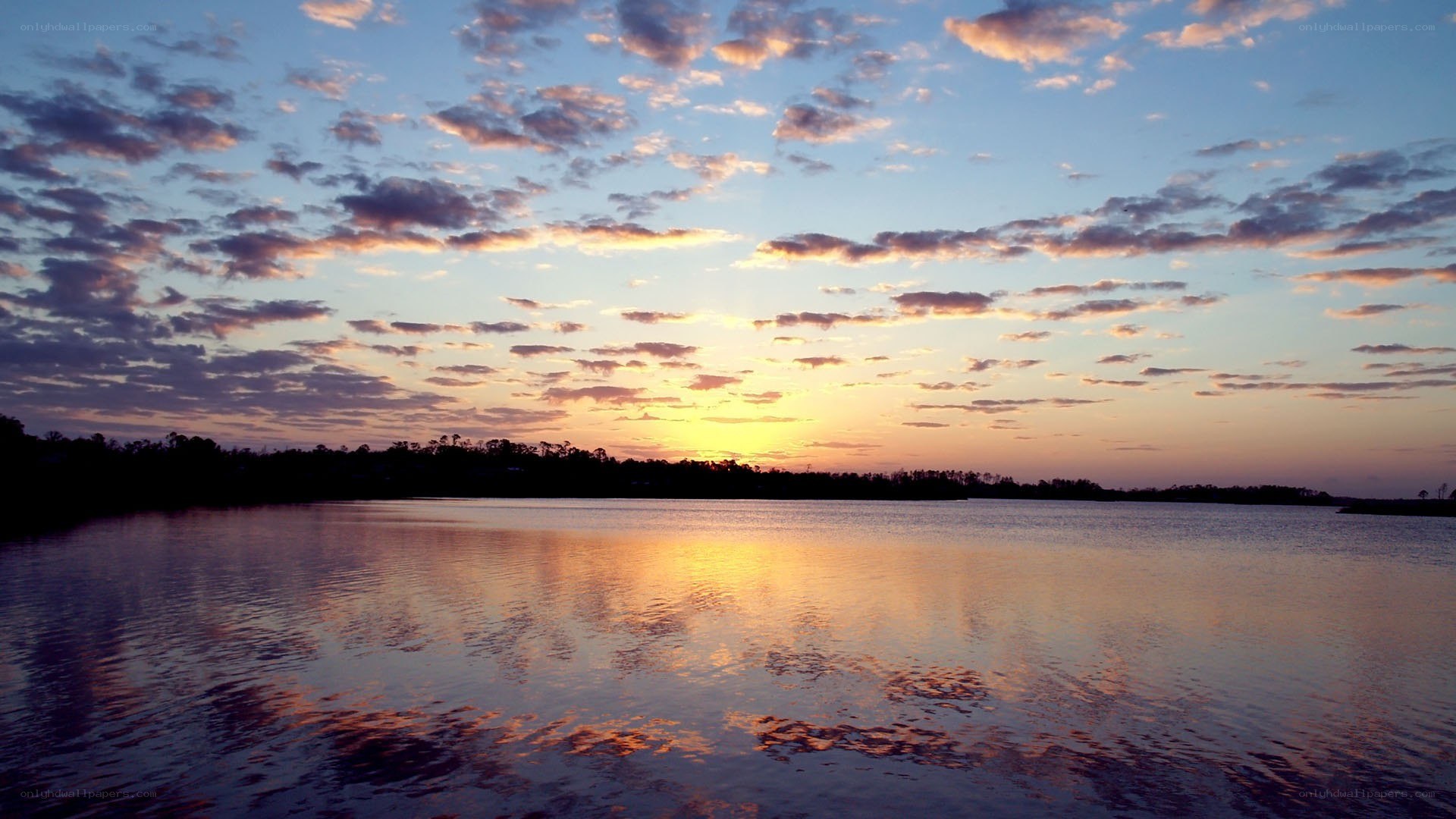 sunset over a calm lake
