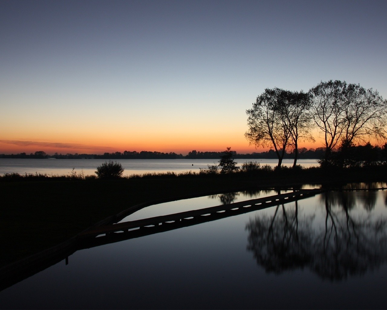 sunset over a calm lake
