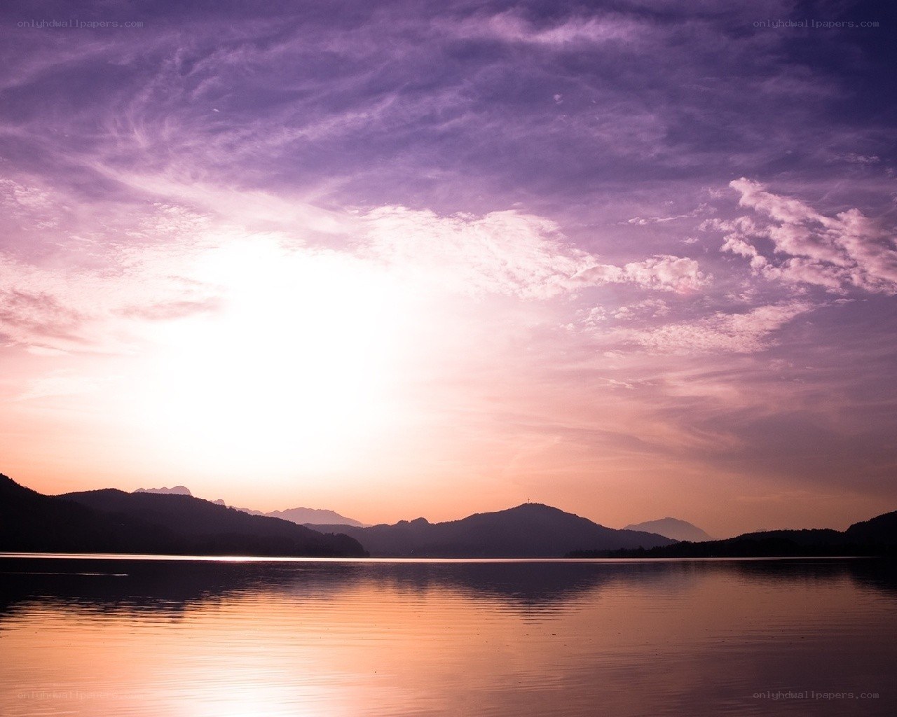 sunset over a calm lake