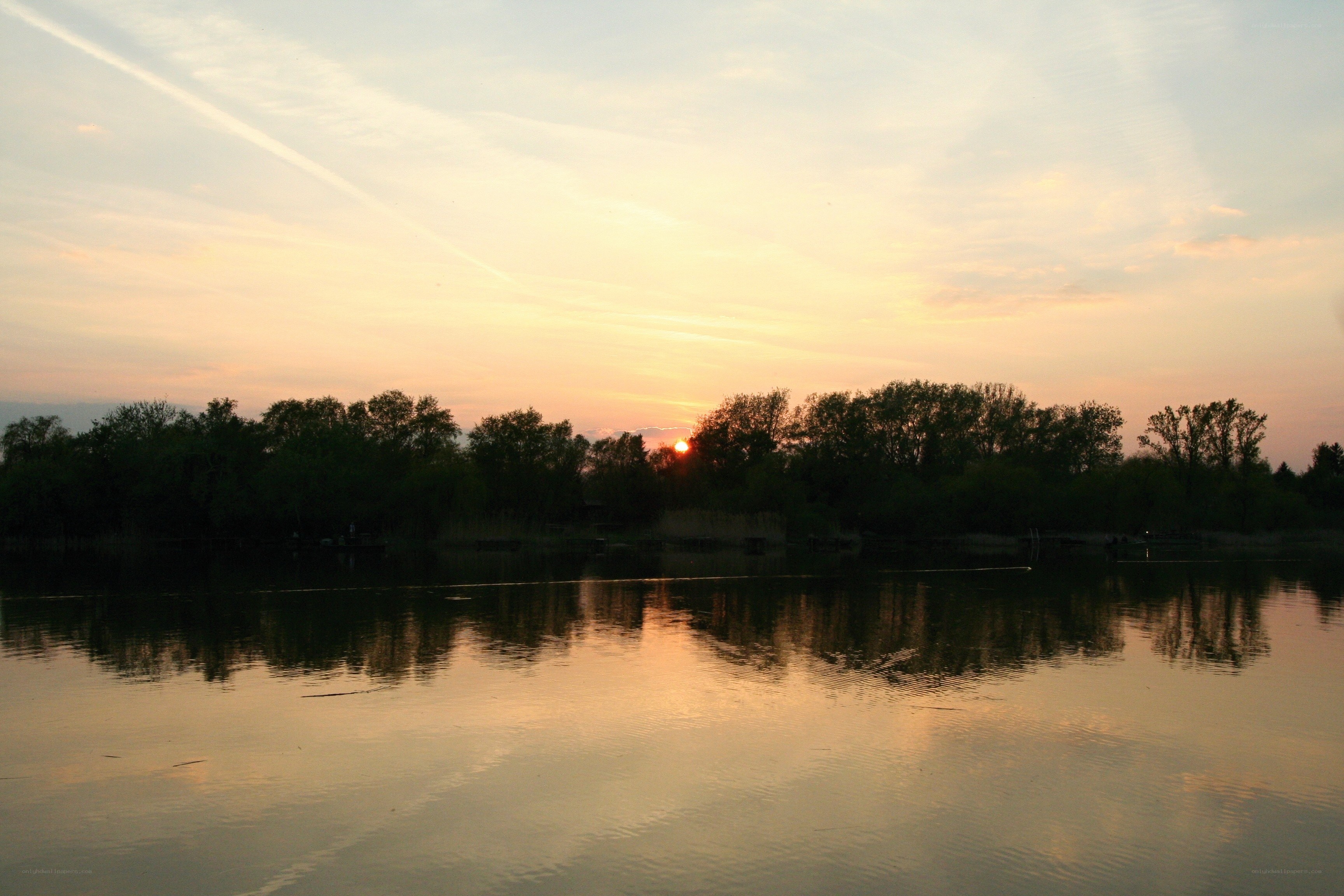 sunset over a calm lake