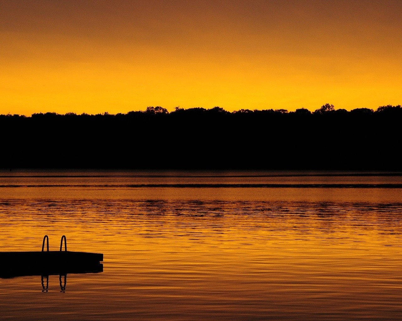 sunset over a calm lake