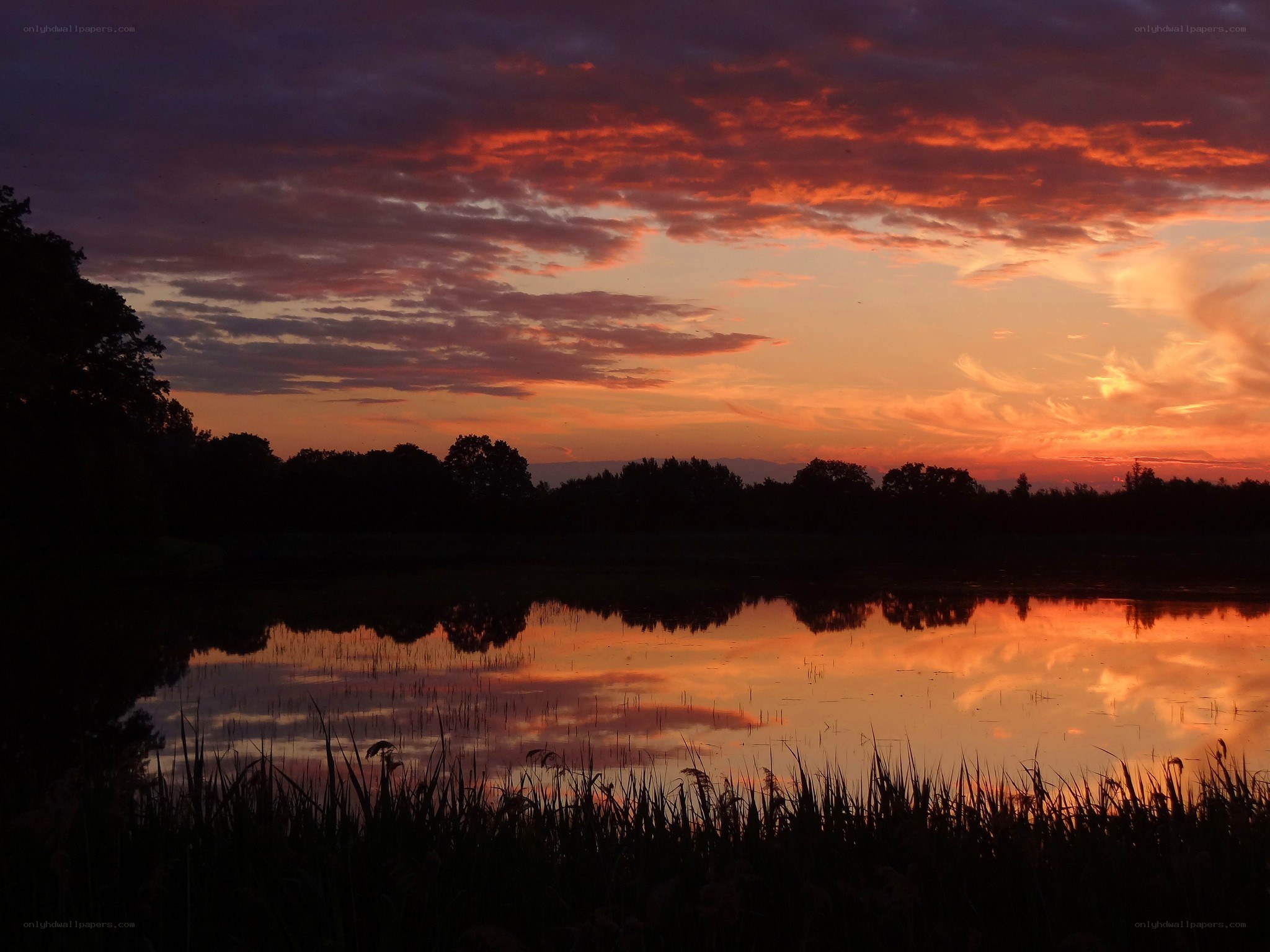 sunset over a calm lake