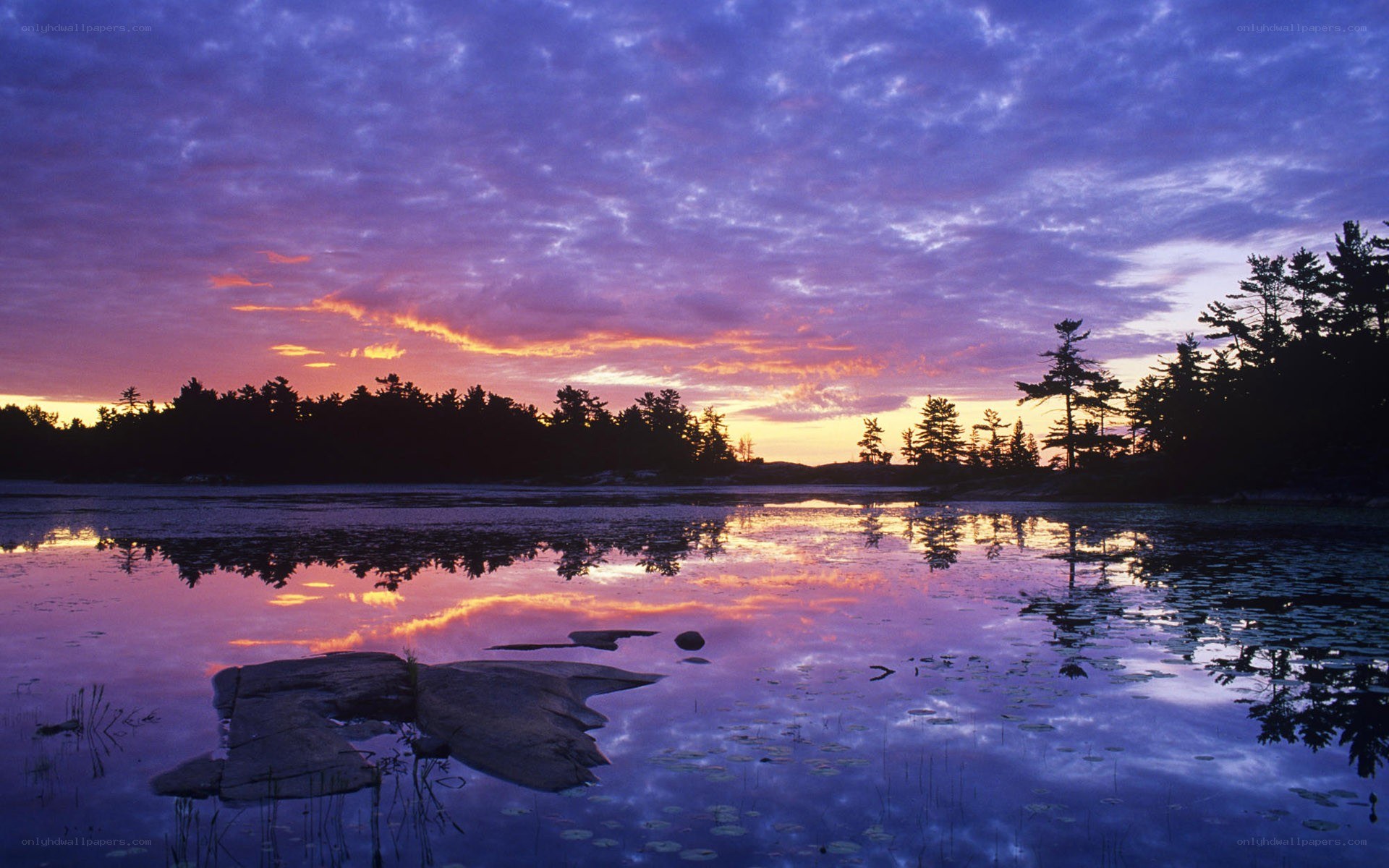 sunset over a calm lake