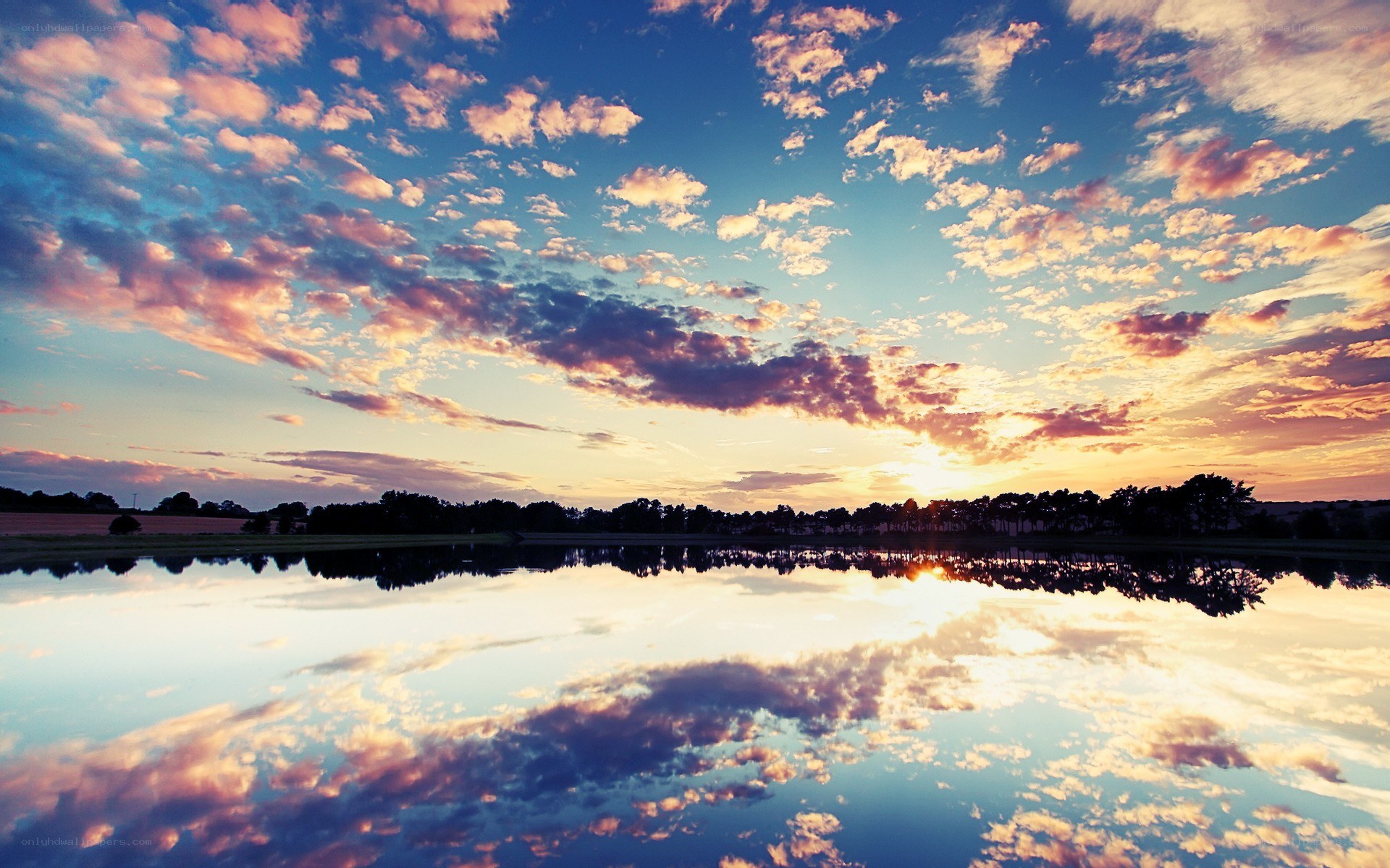 sunset over a calm lake