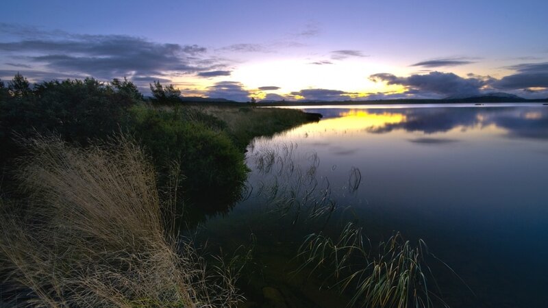sunset over a calm lake