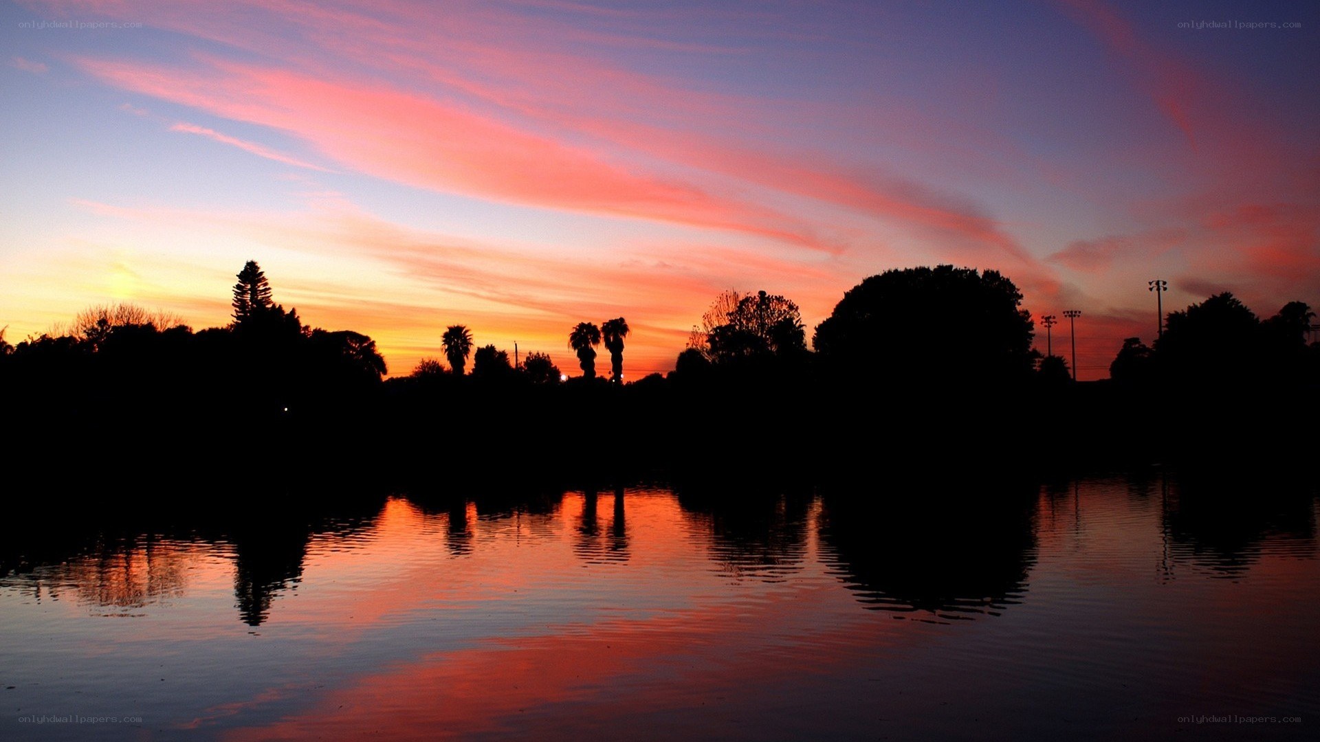 sunset over a calm lake