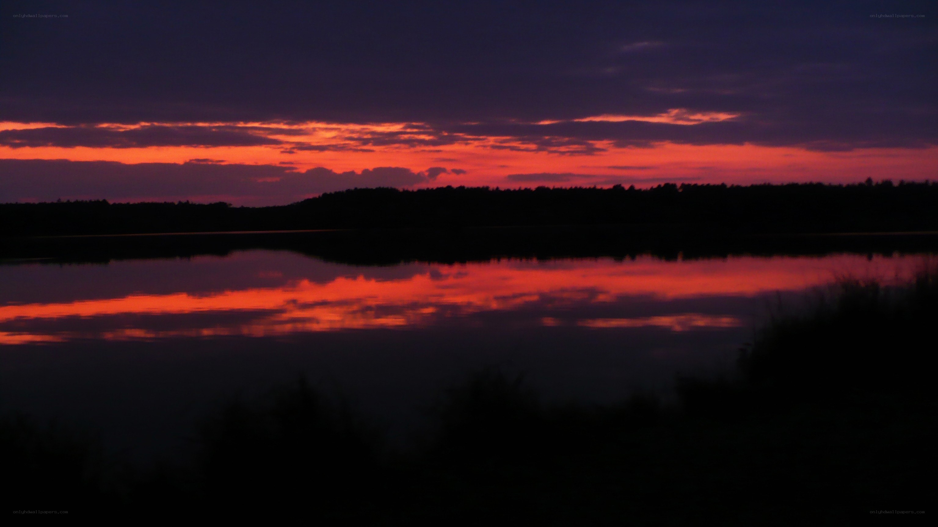 sunset over a calm lake