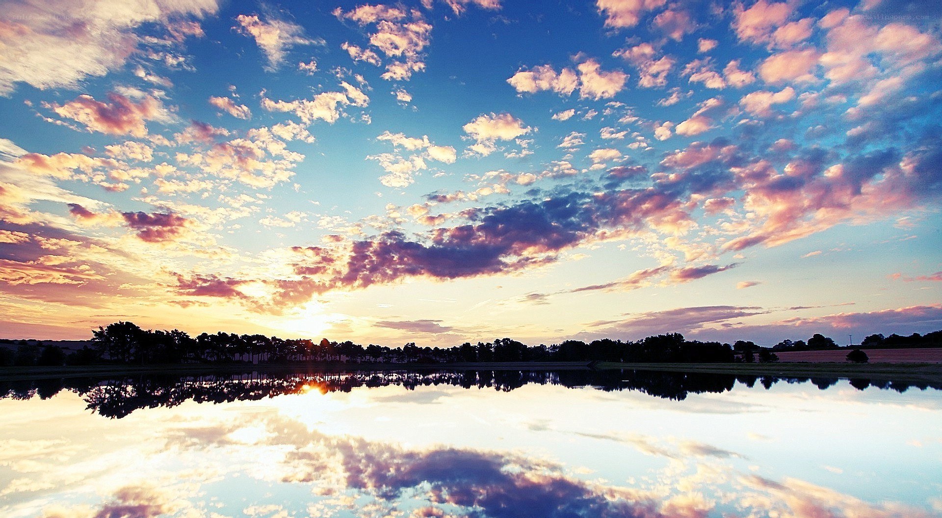 sunset over a calm lake