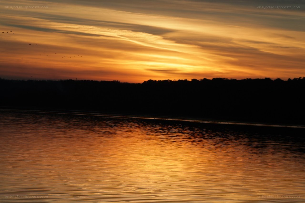 sunset over a calm lake