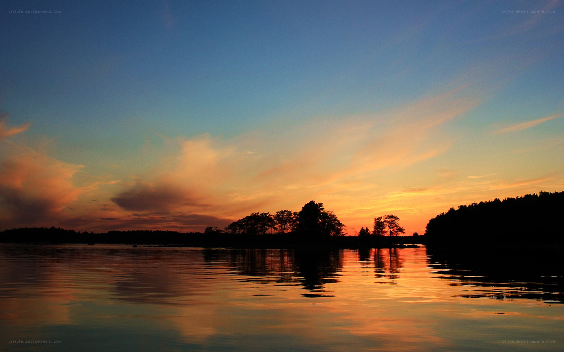 sunset over a calm lake