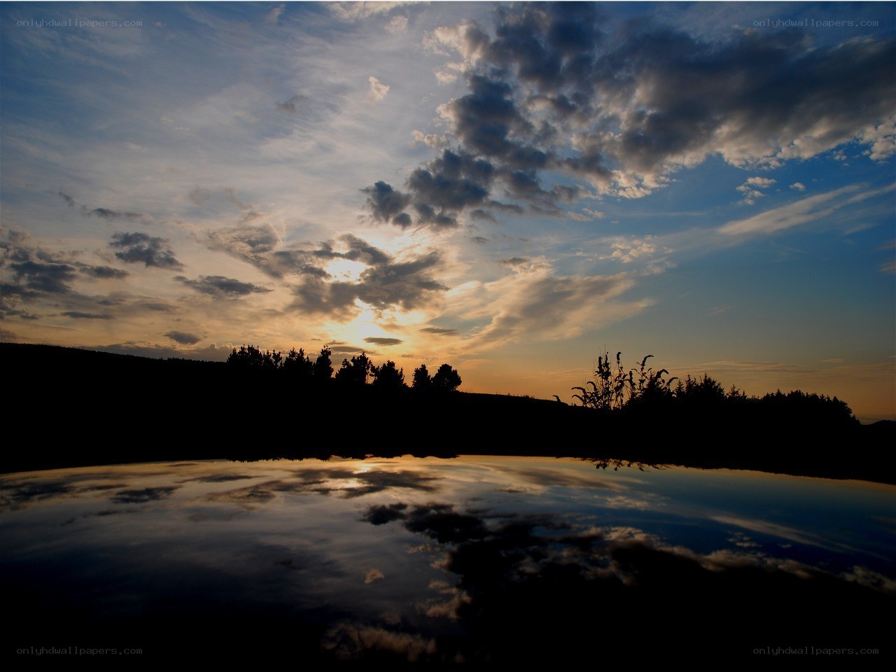 sunset over a calm lake
