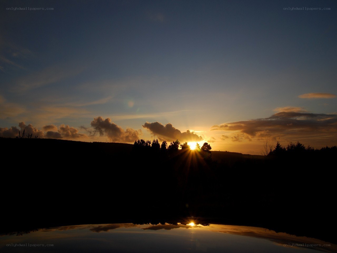 Sunset over a calm lake