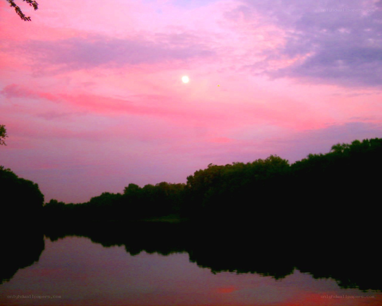 sunset over a calm lake
