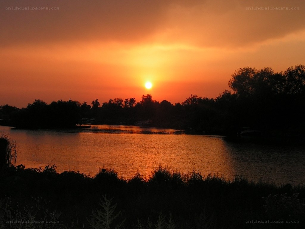 sunset over a calm lake