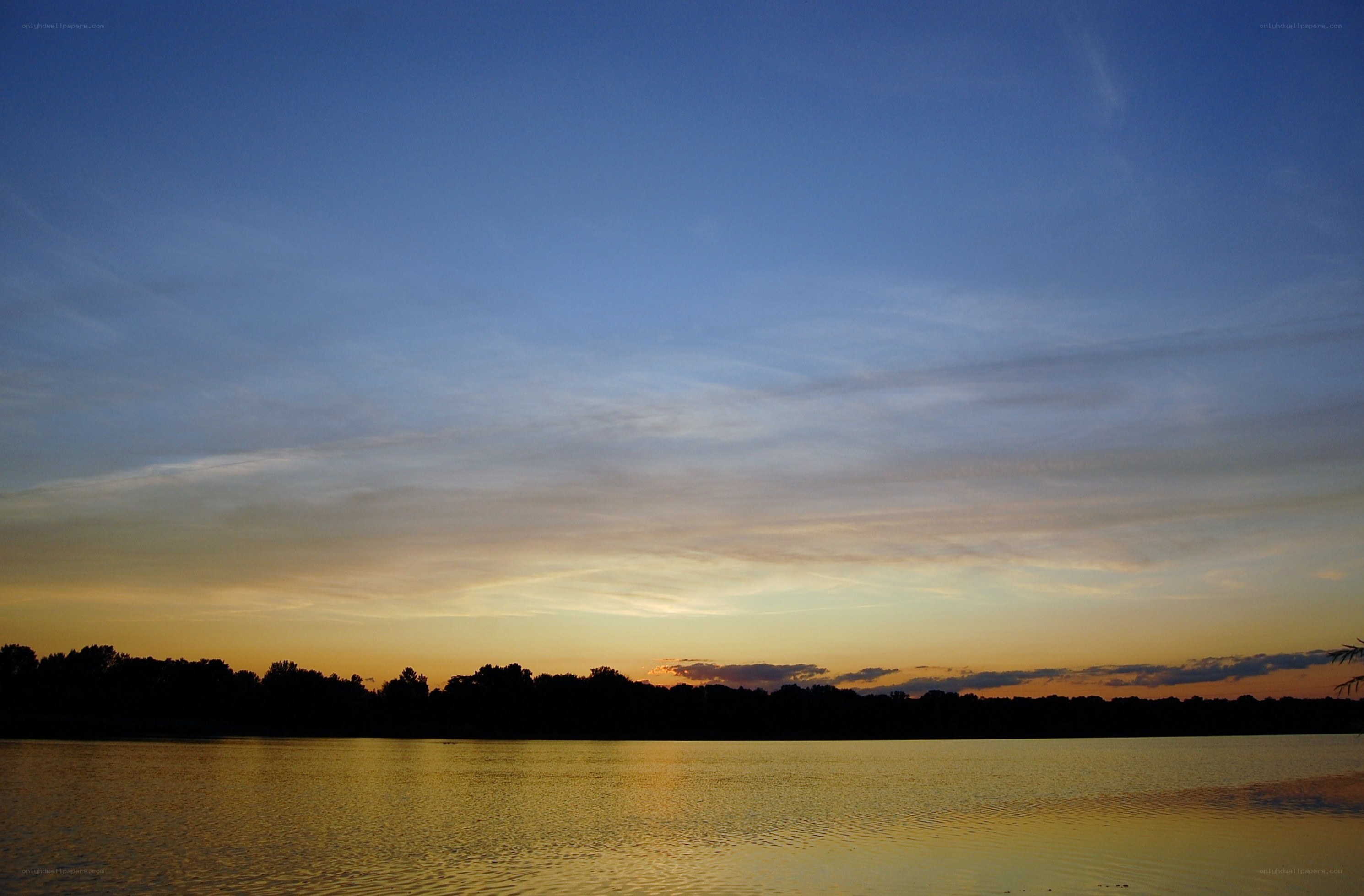 sunset over a calm lake