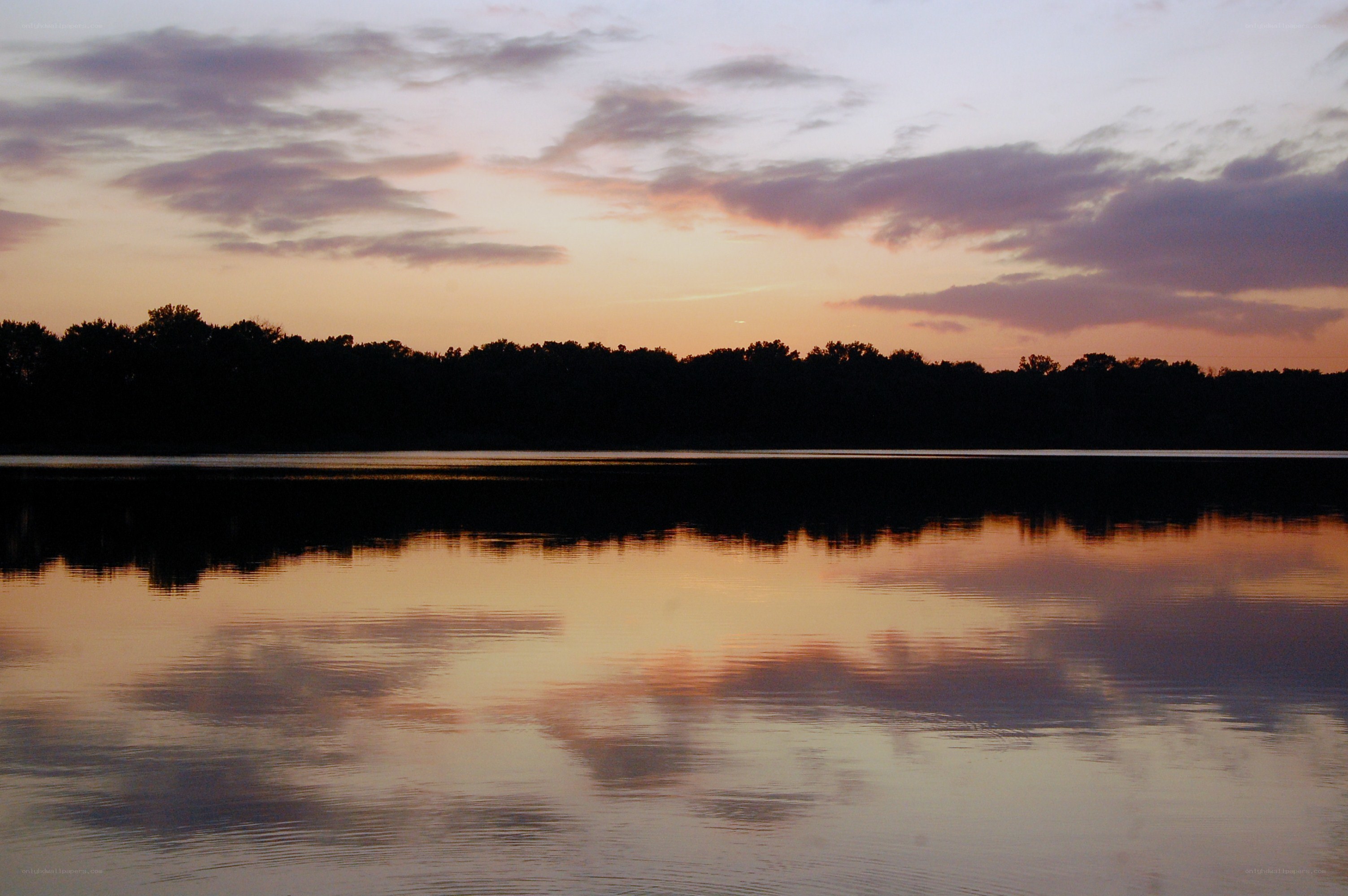 sunset over a calm lake