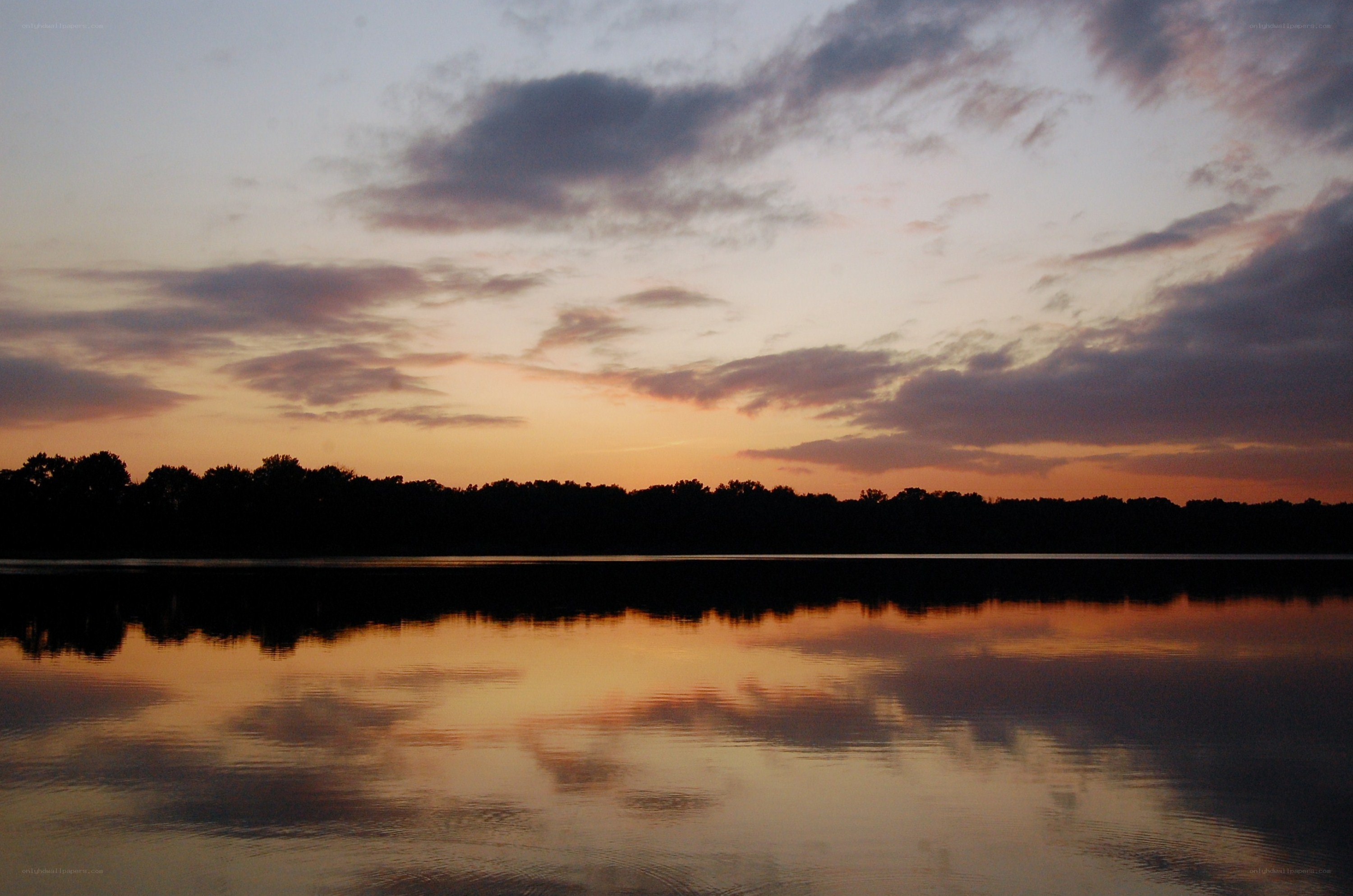 sunset over a calm lake