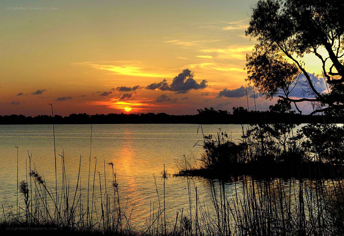sunset over a calm lake