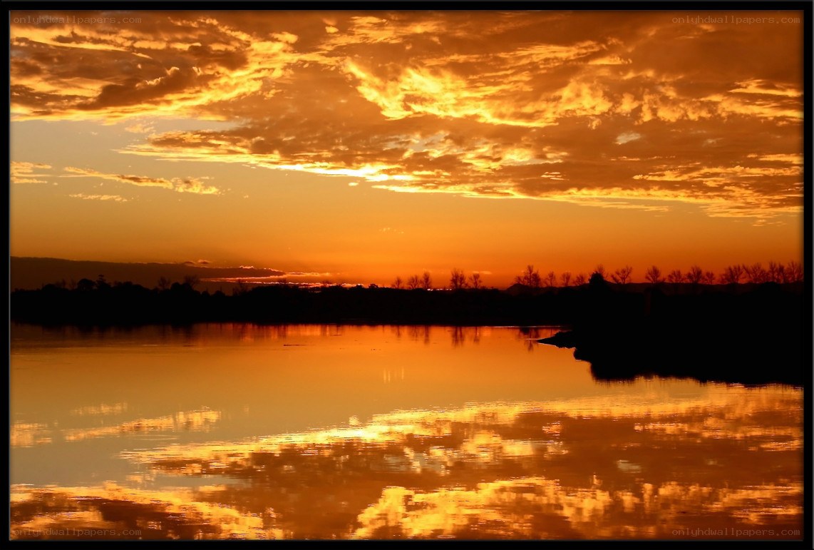 Sunset over a calm lake