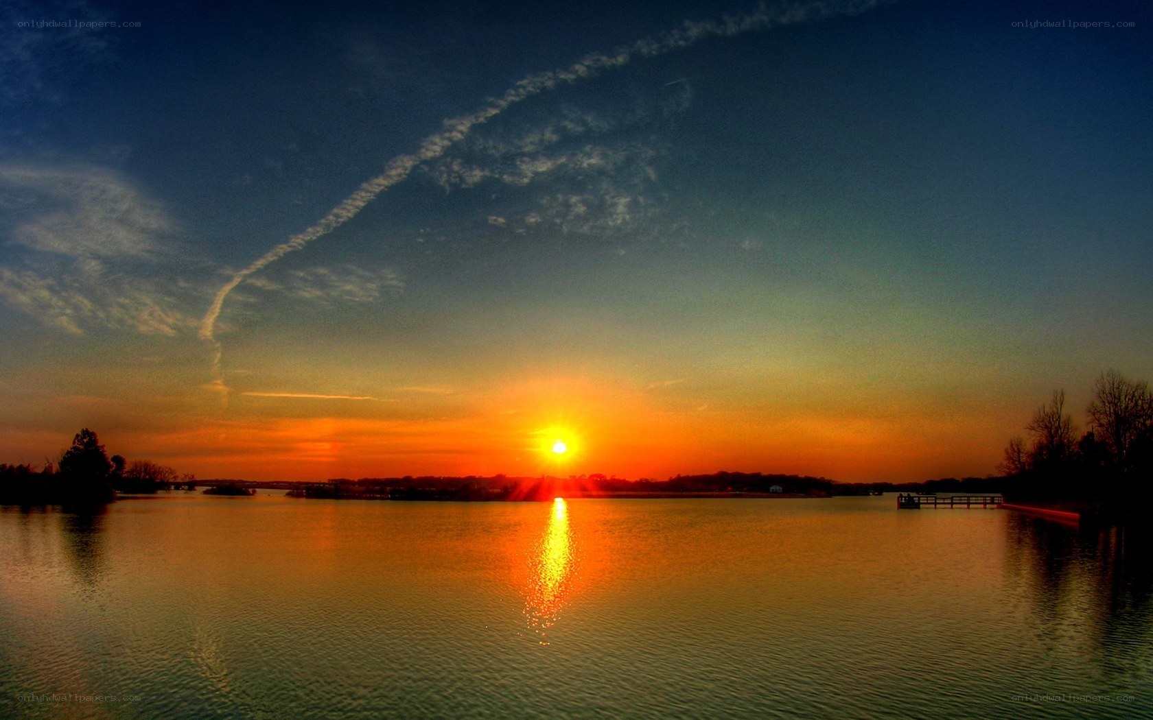 sunset over a calm lake