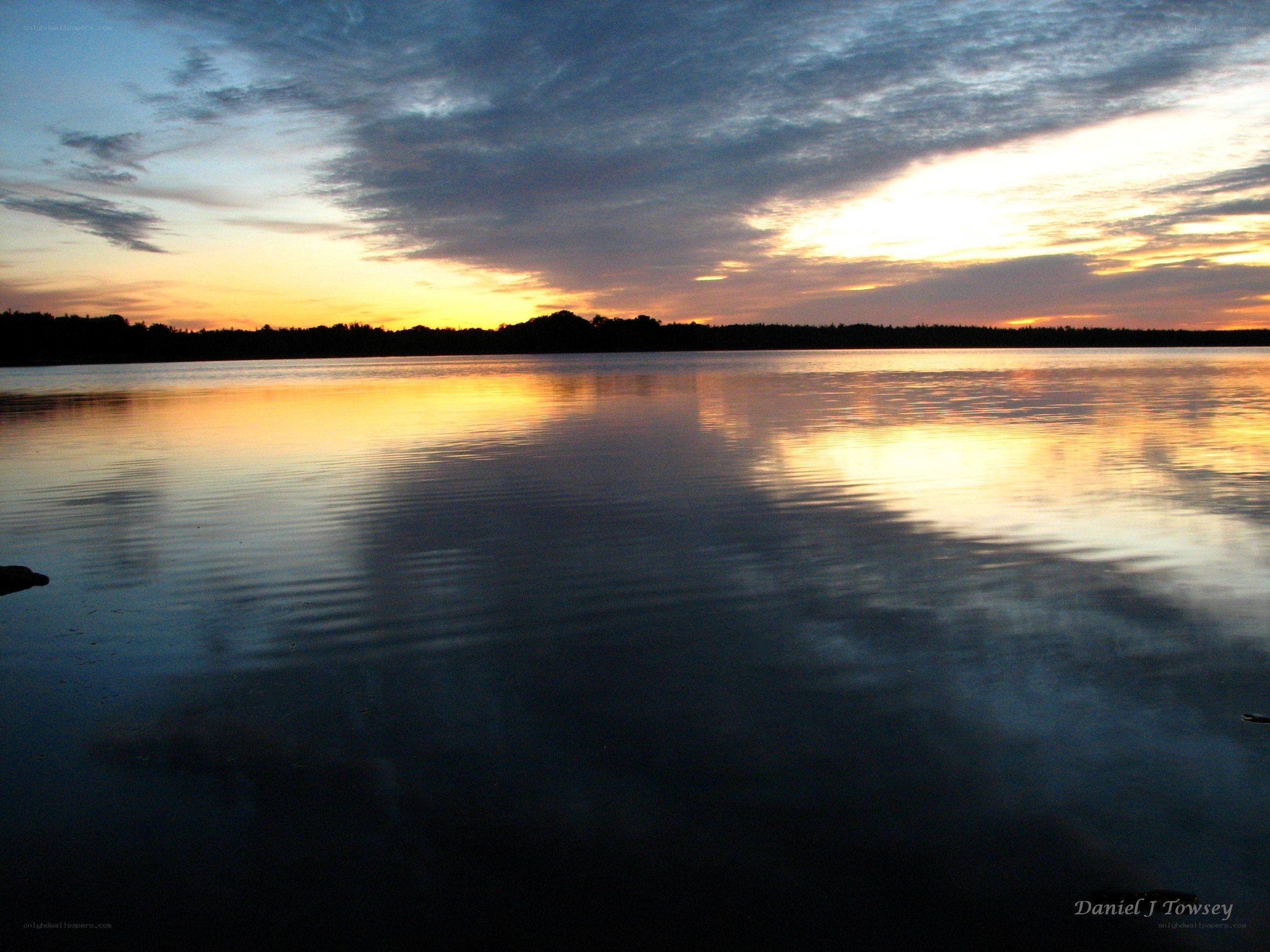 sunset over a calm lake