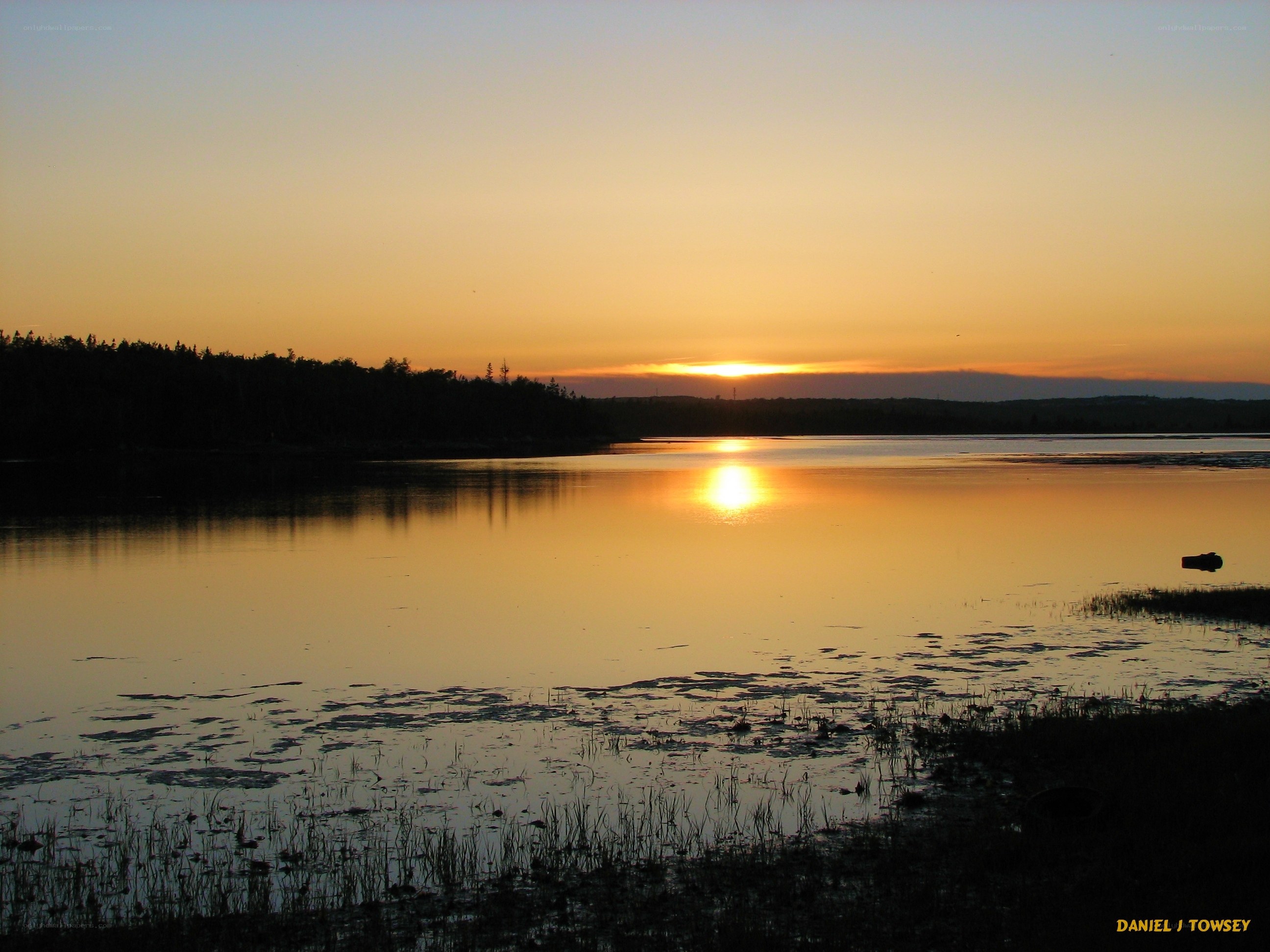 sunset over a calm lake