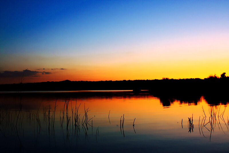 sunset over a calm lake