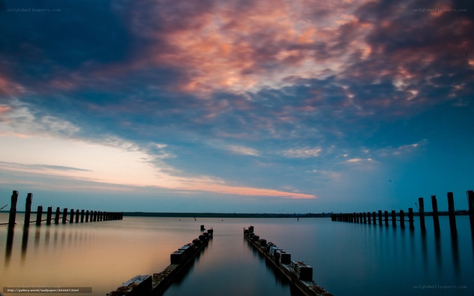 Sunset over a calm pier