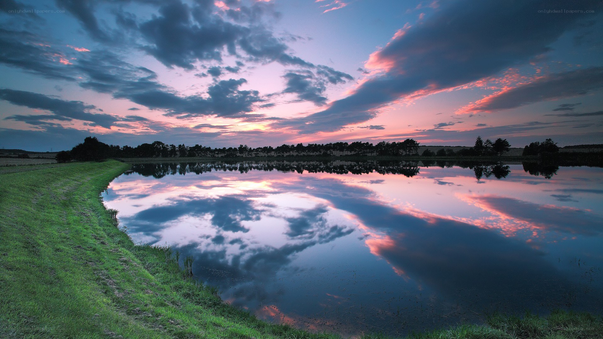 Sunset over a calm pond