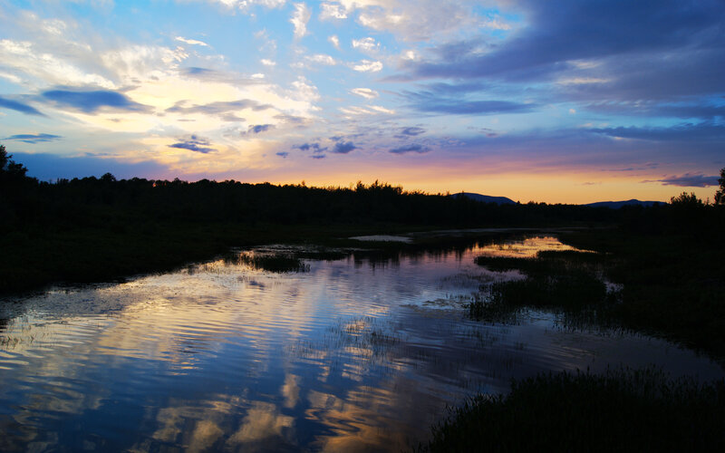 Sunset over a calm river