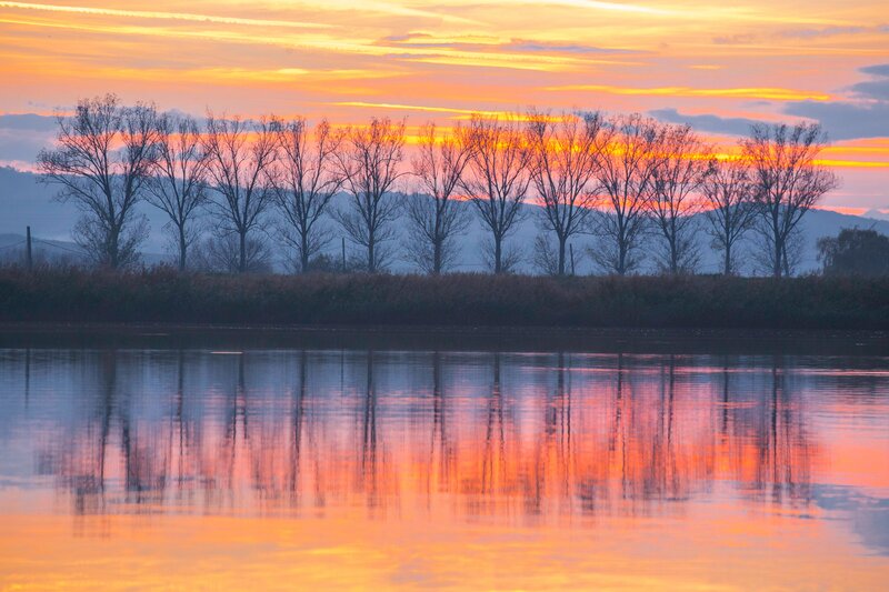Sunset over a calm river