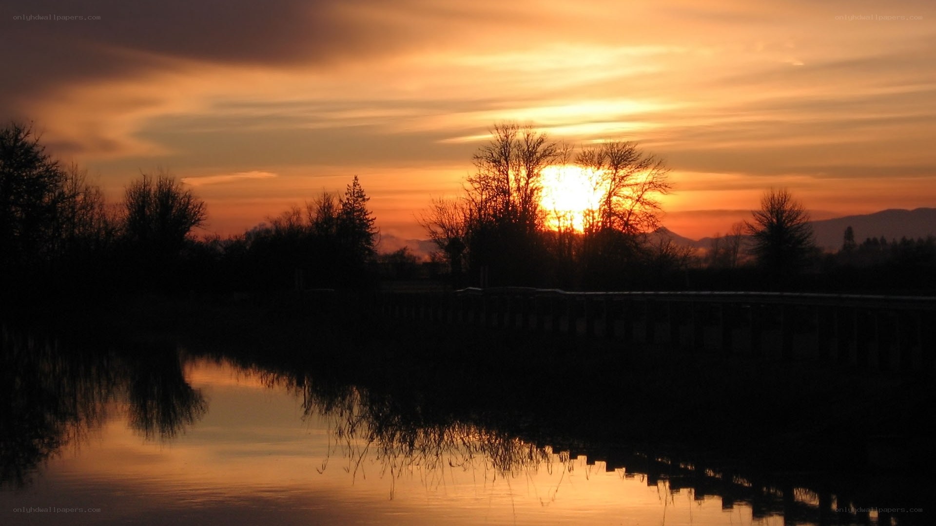 Sunset over a calm river