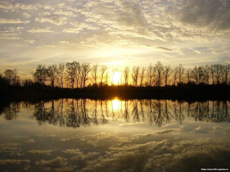 Sunset over a calm river