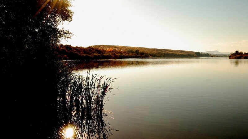 Sunset over a calm river