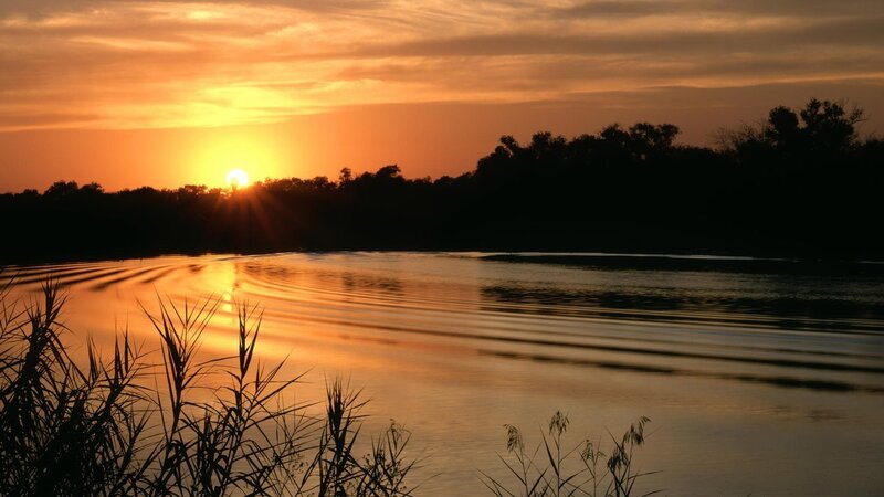 Sunset over a calm river