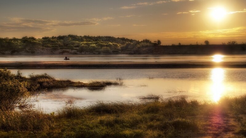 Sunset over a calm river