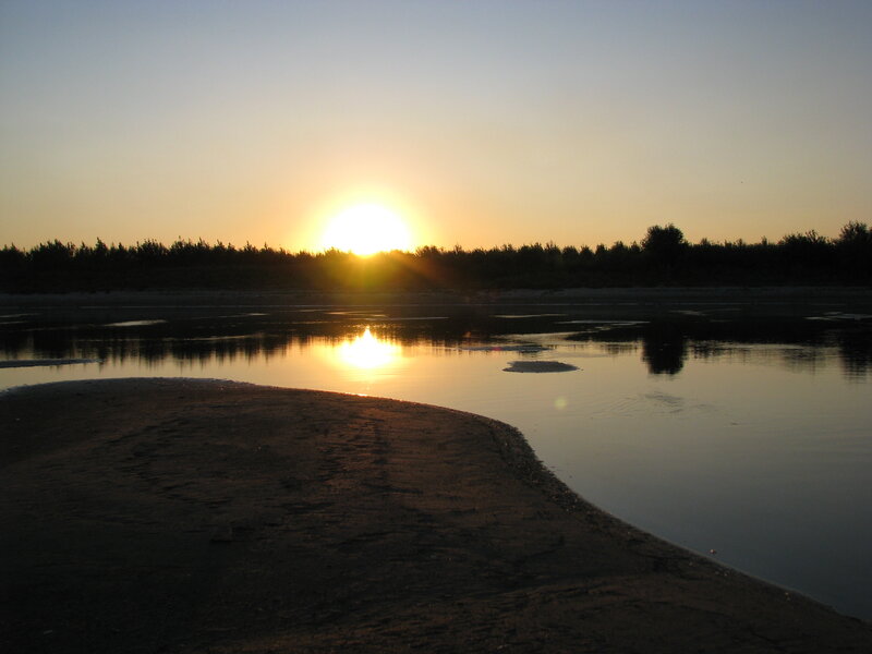 Sunset over a calm river
