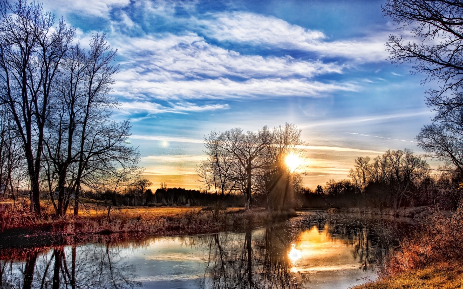 Sunset over a calm river